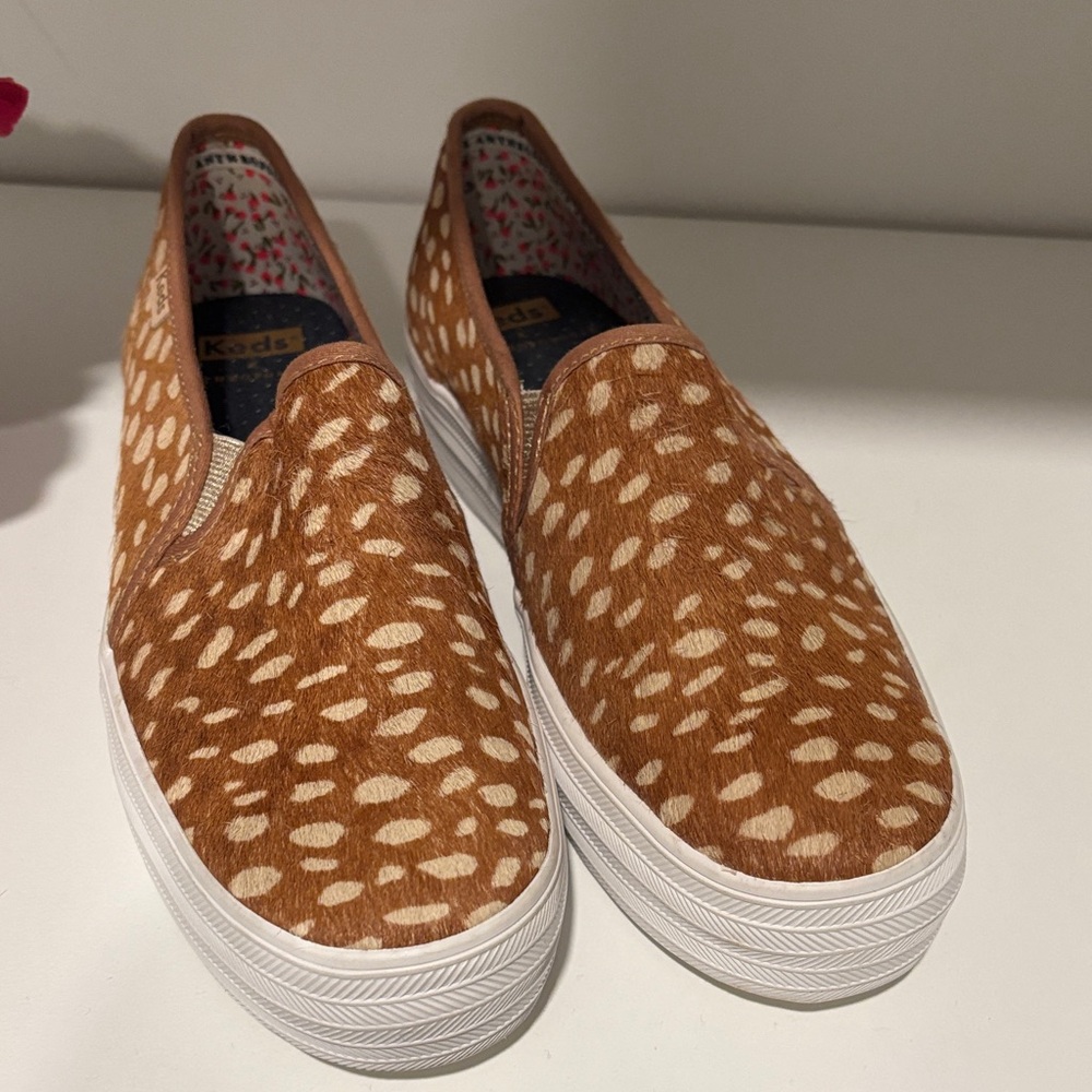 Keds and Anthropologie calf hair patterned slip ons. Tan and white.